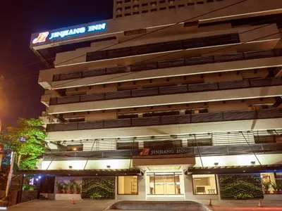 a building with a sign on the side of it at Jinjiang Inn - Ortigas in Manila