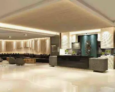 a large living room with a couch and a table at Las Vegas of the Philippines in Pasay Manila Luxury Near NAIA Airport x Solaire x Okada x City of Dreams and Casinos Enjoy FREE Pool Access n HighSpeed WIFI and Netflix Comfort with ResortType Living Secure Your Limited Offer This Month in Manila
