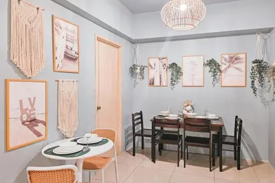 a dining room with a table and chairs at Luxury 2br in Makati with Billiard & Netflix in Manila