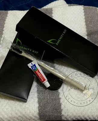 a black box with a pen and a cigarette at Jessa Rios Coast Staycation in Manila