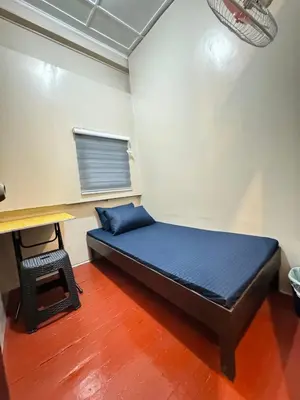 a bed in a room with a blue mattress at 88Ap Lodging House San Marcelino in Manila