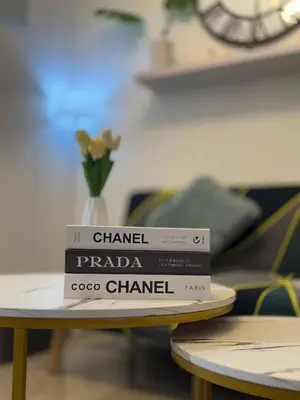 a stack of books sitting on a table at Divine Staycation in Manila