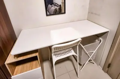 a white desk with a chair in a room at Gaming 2br in Makati with City View Arcade Netflix in Manila