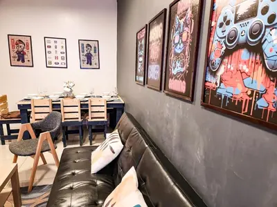 a living room with a leather couch and a table at Gaming 2br in Makati with City View Arcade Netflix in Manila