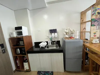 a small kitchen with a sink and a refrigerator at Aras Solace Place in Trece Martires