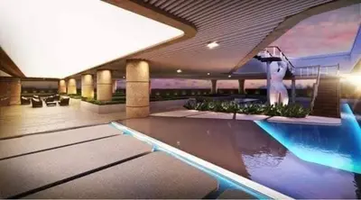 a swimming pool in a building with a pool at City Scape Comforts Makati in Manila