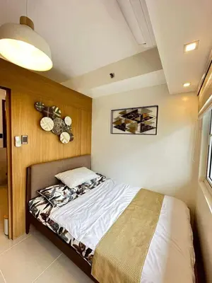 a bedroom with a bed in a room at Condo near MOA and NAIA in Manila