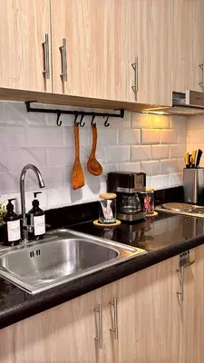 a kitchen with a sink and a counter top at Shore 2 Tower 3 Modern Loft Near Mall of Asia in Manila