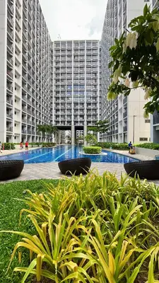 a large building with tall buildings in the background at Shore 2 Tower 3 Modern Loft Near Mall of Asia in Manila