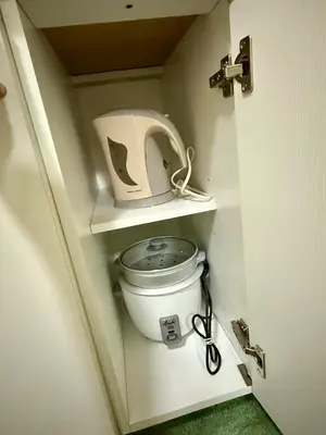 a bathroom with a toilet in a small room at Verte Hideaway at Azure Residences - Urban Escape in Manila