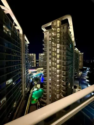 a view of a city at night with buildings at Verte Hideaway at Azure Residences - Urban Escape in Manila
