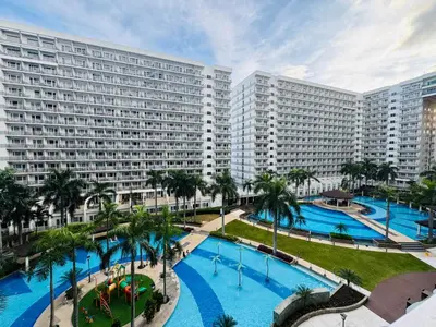 an aerial view of a large apartment building with two pools at Shell Residences Tower A in Manila