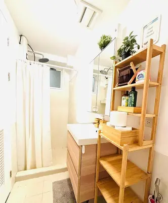 a bathroom with a sink and a mirror at Free Car Parking - Sheridan North 1BR Apt near BGC in Manila