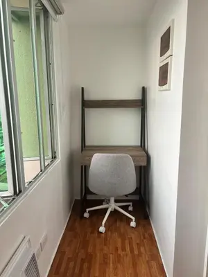 a desk and a chair in a room with a window at Loft in Boni - Work friendly - Cityview - up to 8pax in Manila
