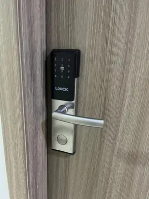 a door opener with a remote control in it at Aras Solace Place in Trece Martires