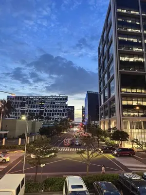 a city street with cars parked in a parking lot at HY Place Manila in Manila