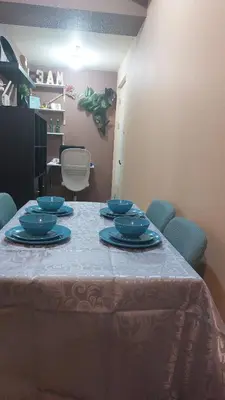 a table with blue dishes sitting on top of it at Affordable Whole 2 bedroom Condo high floor BGC in Manila