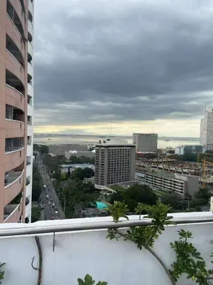 a view of a city from the balcony of a building at I suites in Manila