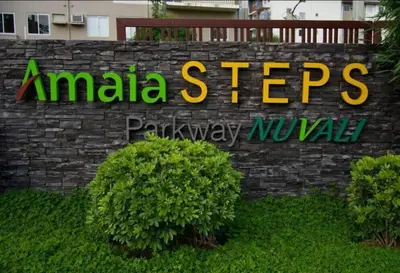 a sign that says amica steves on a brick wall at Joms Cozy Staycation in Calamba