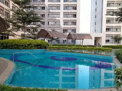 an empty swimming pool in front of a building at VM Staycation Tower 3 Grace Residence Taguig in Manila