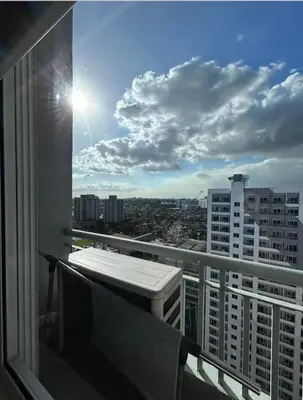 a balcony with a view of a city at VM Staycation Tower 3 Grace Residence Taguig in Manila