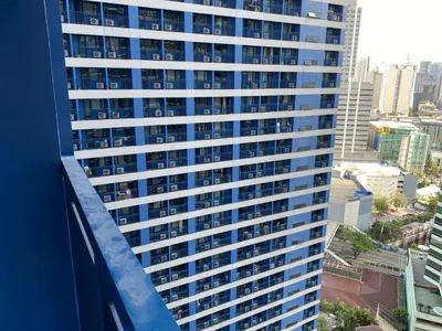a view from the balcony of a tall building at Family Oasis Makati 2 bedroom 1 kiddo room 300 mbps Fast Net in Manila