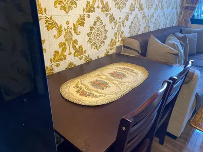 a wooden table with a plate on top of it at Family Oasis Makati 2 bedroom 1 kiddo room 300 mbps Fast Net in Manila