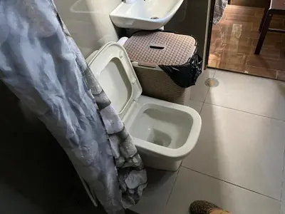 a bathroom with a toilet and a sink at Family Oasis Makati 2 bedroom 1 kiddo room 300 mbps Fast Net in Manila