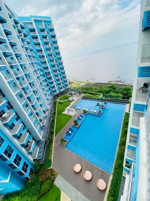 an overhead view of a swimming pool between two buildings at Serendipity staycation in Manila