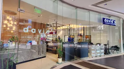 a store front of a store with glass windows at 14F BGC Unit 3 mins Walk to The Venice Grand Canal Mall Pet Friendly in Manila
