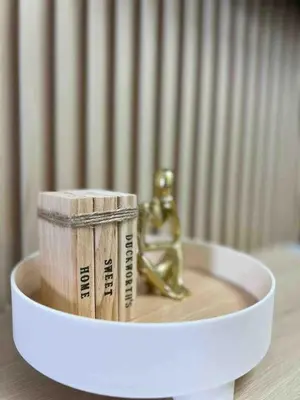 a figurine of a dog and a roll of money at Stylist hideaway in d heart of MOA in Manila