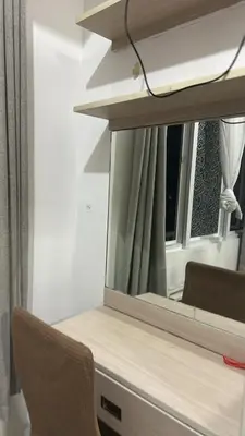 a mirror on top of a desk with a chair at Chays Place in Manila