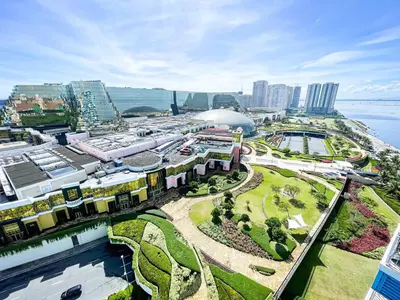 an aerial view of a city with a train station at Luxury 1BR across Okada, Solaire in Manila