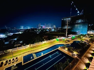 a view of a swimming pool at night at Jungle Escape in Manila