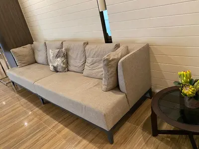 a couch in a living room with a table at 3 Bedroom Air condo Pool Perfect Holiday Gym Swim 300 Mbps in Manila