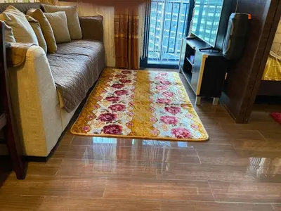 a rug on the floor in a living room with a couch at 3 Bedroom Air condo Pool Perfect Holiday Gym Swim 300 Mbps in Manila
