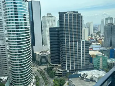 an aerial view of a city with tall buildings at Chic Luxury Air condo 2 Bedroom Finest City Living Air Makati Gym Swim Park 300 in Manila