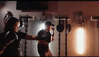 a man and a woman boxing in a gym at Chic Luxury Air condo 2 Bedroom Finest City Living Air Makati Gym Swim Park 300 in Manila