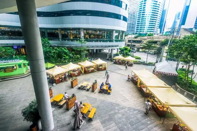 an overhead view of a street with tables and buildings at Cozy Peacock hideaway Stylish Makati Condo 300 Mbps Gym Swim Park in Manila