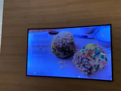 a picture of two donuts with sprinkles on a table at Cruise Ship Condo Escape Makati 300 Mbps Gym Swim Park 2271 in Manila