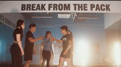 a group of people standing under a sign that reads break from the pack at Cosmo Nest Air Skyline One BR Makati 2270 Gym Swim Park 300 Mbps in Manila