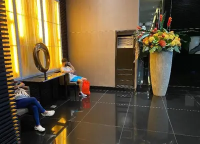 a group of people sitting in a waiting room at Cosmo Nest Air Skyline One BR Makati 2270 Gym Swim Park 300 Mbps in Manila