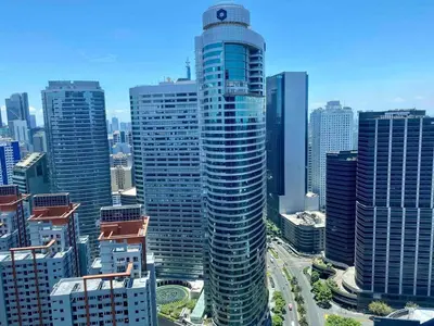 a view of a large city with tall buildings at Jazz Air Rooftop Penthouse Bar Gym Swim Park 300 Mbps Air 4034 in Manila