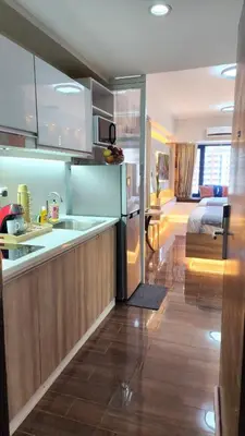 a kitchen with a sink and a counter top at Air residence Fantasy Sophisticated Heaven on earth Gym Swim Park 300 MB in Manila