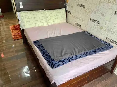 a small bed in a room with at Makati Broadway Bliss Golden spot Gym Swim Park 300 Mbps 1940 in Manila