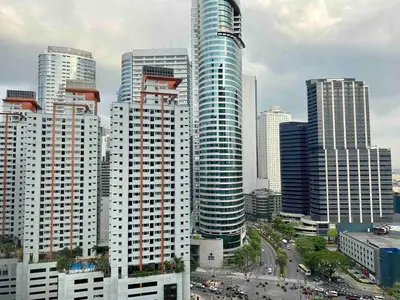 a city with tall skyscrapers in a city at Makati Broadway Bliss Golden spot Gym Swim Park 300 Mbps 1940 in Manila