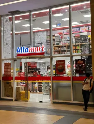 a woman standing in front of an air mart store at High Rise Haven in Makati with Balcony and View in Manila