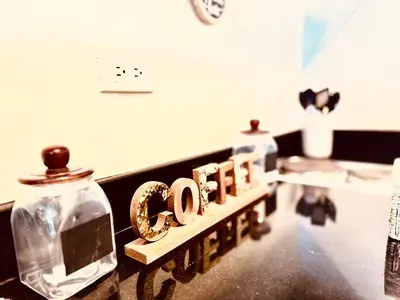 a sign that says ego on a counter in a salon at High Rise Haven in Makati with Balcony and View in Manila