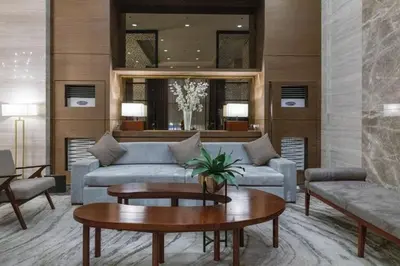 a living room with a couch and a table at 1 BEDROOM Staycation in Manila