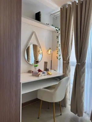 a dressing table with a mirror and a chair at Chic Staycation with Balcony,few step in venice mall in Manila